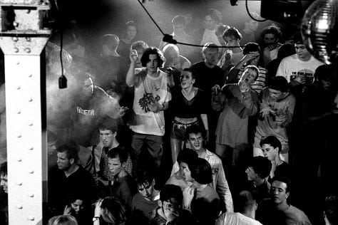A nightclub and people dancing and partying