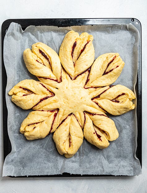 Making cranberry orange star bread.