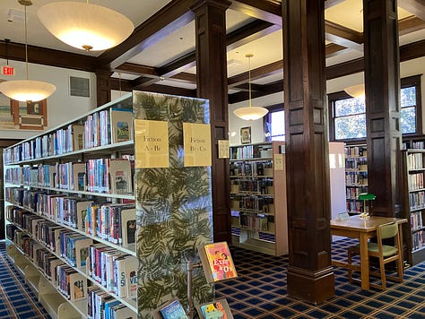 Library photos showing books, computers, and the author