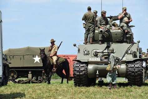 Images from the Military Weekend, featuring WWII tanks, vehicles and even a horse and cavalry rider.