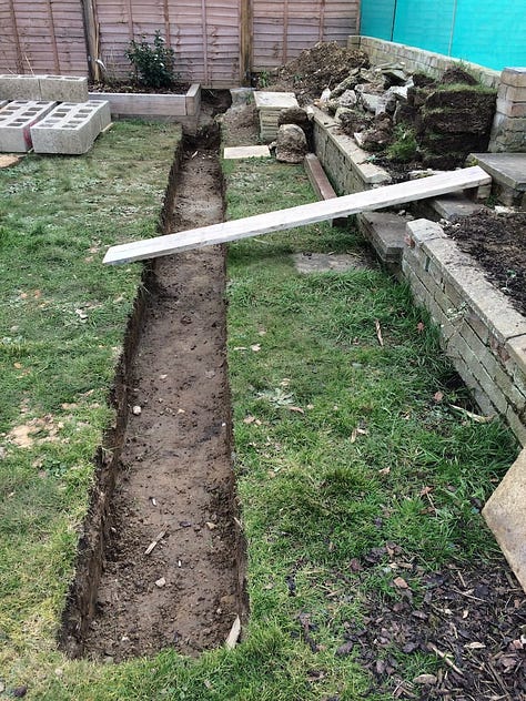 preparations of digging out the garden in preparation for the construction of the garden wall