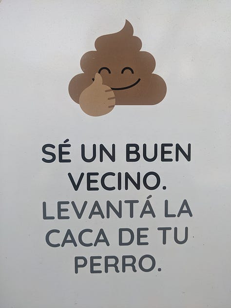 A sign about picking up dog poop i.e. caca, a sign for fire extinguishers i.e. matafuegos i.e. fire-killers, and a sign for a men's bathroom saying caballeros i.e. cowboys