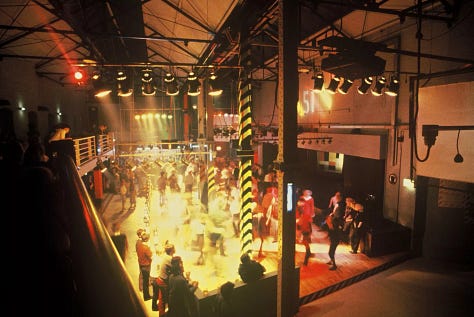 A nightclub and people dancing and partying