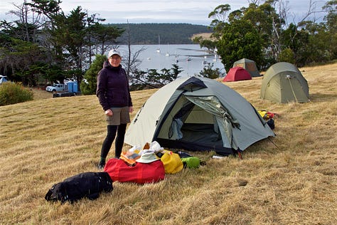 camping on Quarantine Bay, showing tents and people on top of a midden