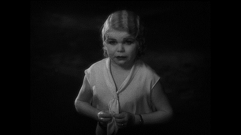 Black-and-white images of actor Daisy Earles appearing as Frieda in "Freaks", a blonde-haired woman with pituitary dwarfism. In all 3 images she is looking into the camera, and wearing a white dress; in the first 2 she is sat on a pony.