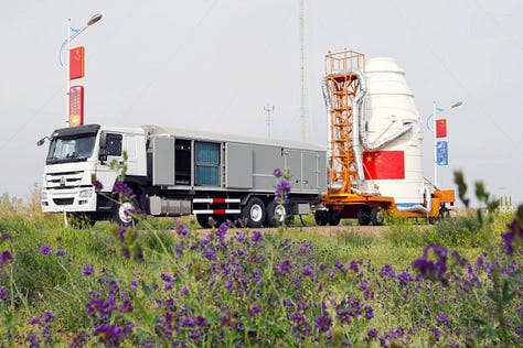 Hardware for the Long March 2D being prepared for integration at Jiuquan along with the rockets fairing heading to the launch pad.