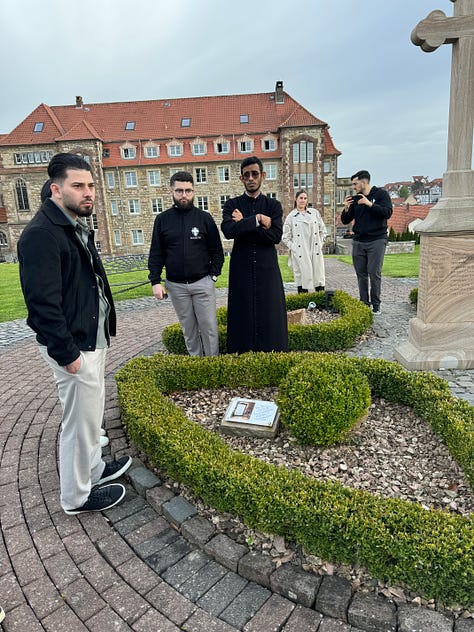 People looking at a monastery