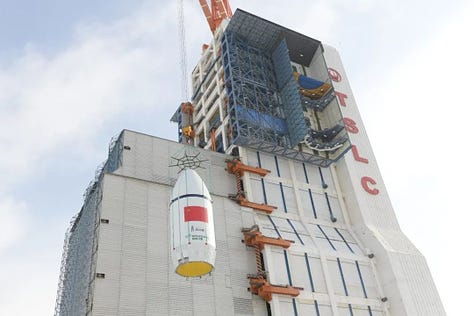 Hardware for the Long March 6A Y22 vehicle being stacked ahead of launch and heading to the launchpad.