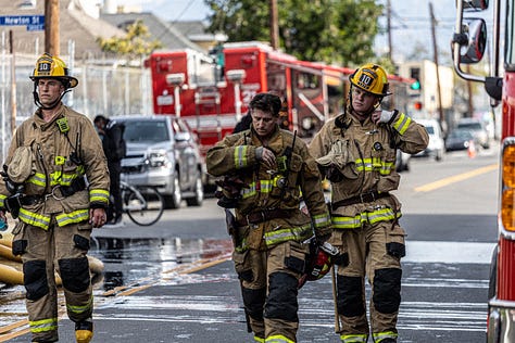 images of firemen working a fire in downtown LA's produce district