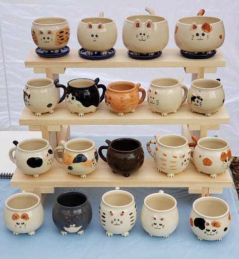 Kitty shaped mugs from different angles.