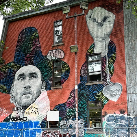 three colorful murals painted on buildings