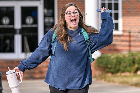 Students walk across the Troy campus heading to class