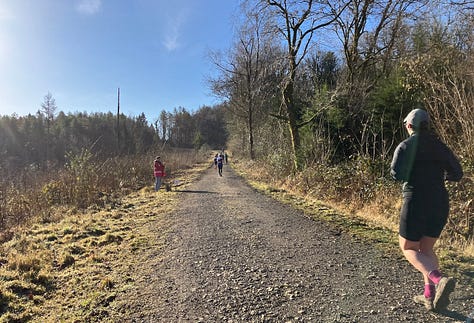 Wide stony paths heading upwards, with a bright blue sky above