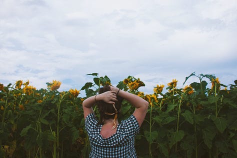 sunflower, woman's silhouette on the wall, a woman in a field of sunflowers