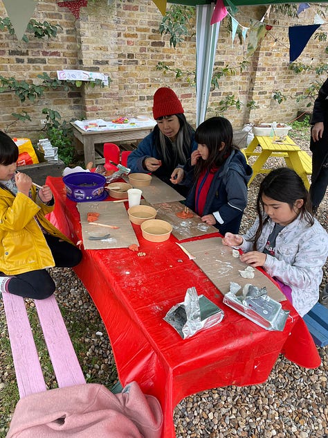 craft table with clay and natural materials, face painting and flower bulbs to plant