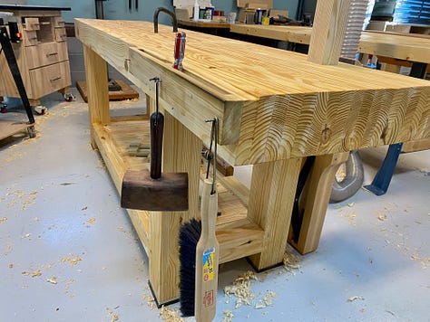 Various images of the workbench showing a crack in the top, gaps in the top being filled, and a plane stop sitting on the top.