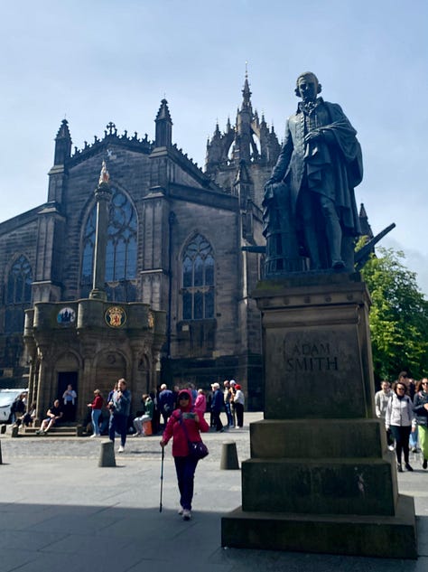 The Royal Mile; the front of Scotland's Parliament building; a statue of Adam Smith in front of St. Giles Cathedral. Photos: Miranda Miller, 2025.