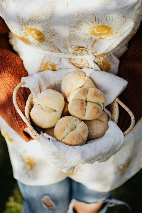 a row of three photos showing Belgian style bread rolls, 1st on a marble background with cream cheese, 2nd in bread basket, 3rth close-up of kaiser bun