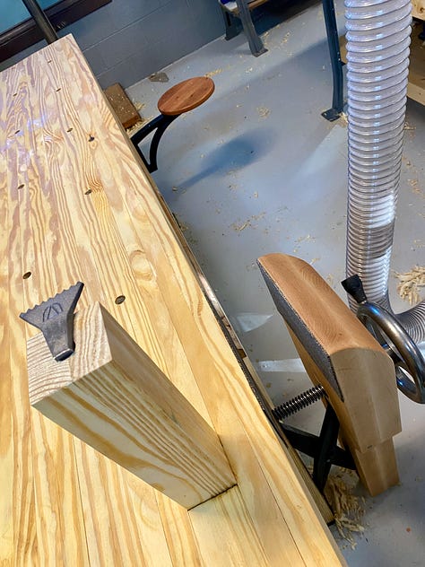 Various images of the workbench showing a crack in the top, gaps in the top being filled, and a plane stop sitting on the top.