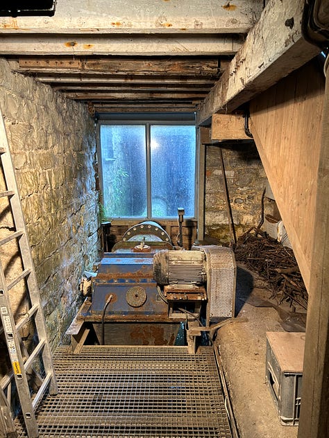 10 photographs showing the inside of Town Mill, Lyme Regis. The milling is done on two floors. On the upper floor the grain is poured into the hopper from where it falls by vibration and gavity down to the millstones below. The grain is then ground and falls into the waiting bag. Flour is sold at the mill and one photo shows bags of flour in plain brown paper bags. Images: Roland's Travels