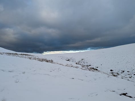 Sunset walk on Pen y Fan in winter with snow 