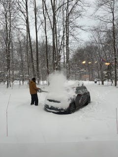 A group of nine images that showcase a snowcovered car, a man cleaning off the snow covered car, and other picture sof a snowy season