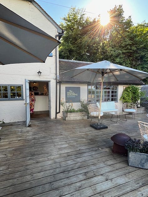 Nine images showing the outside seating area of The Small Holding with images of crops growing in the vegetable garden