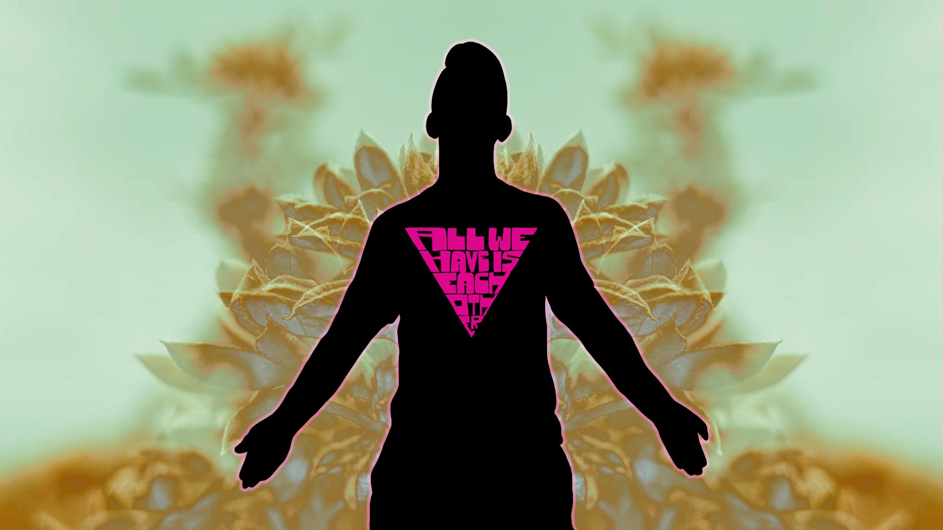 Paul's Queerly Complex World: A silhouette of a person with shorter hair and their arms stretched out wearing the All We Have Is Each Other tee that has a pink glow around it. They are set against a manipulated photo of a succulents. The main colors of the background are a pale sea foam green, a golden yellow, and a light periwinkle.