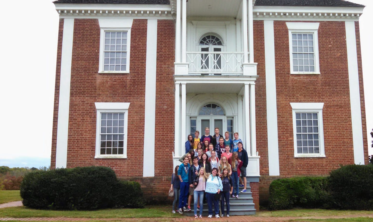 Group on steps of large antebellum house