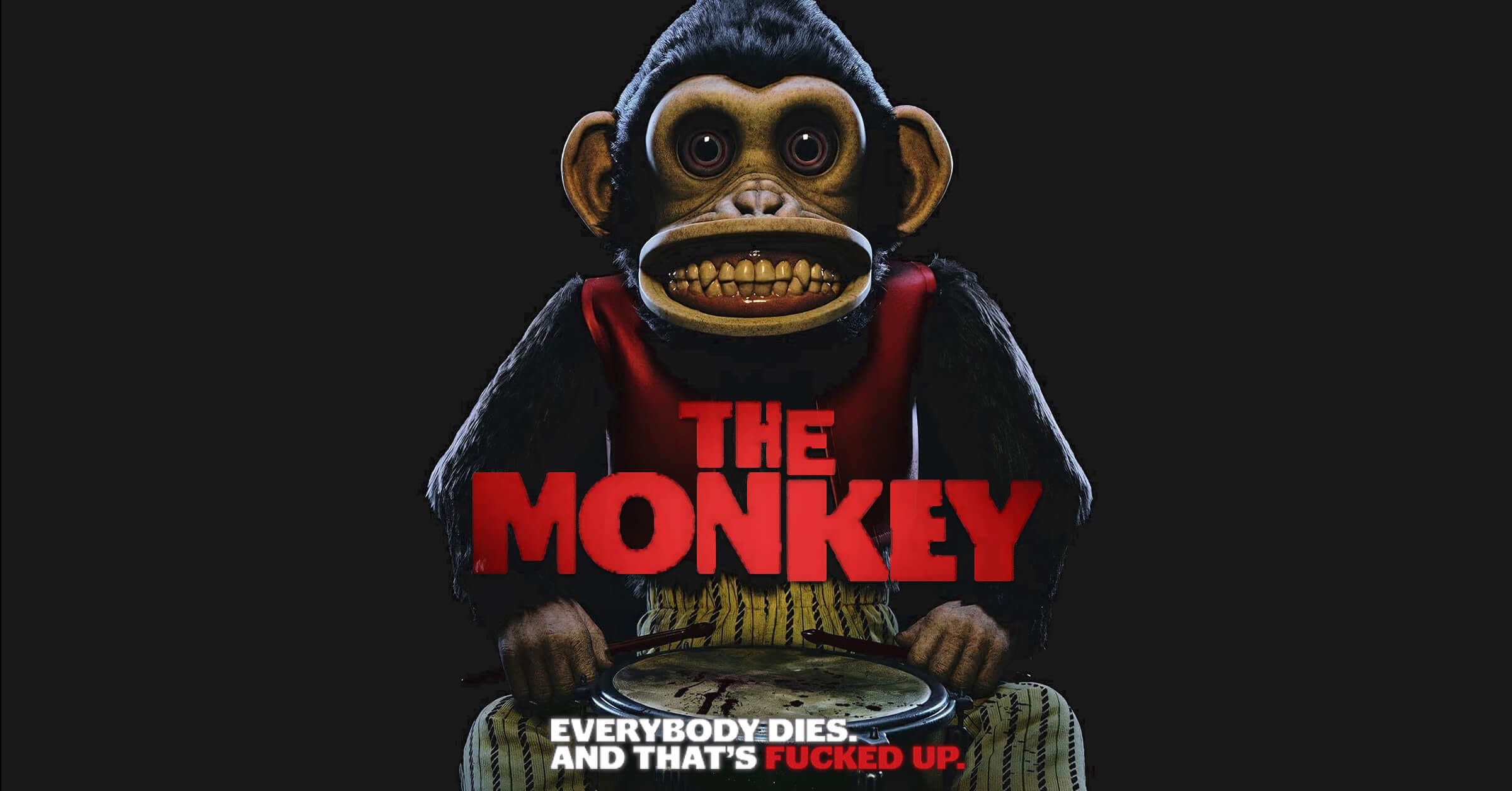 Poster art for The Monkey (2025, featuring a drum-beating monkey toy bearing human teeth in a wide grin, staring blankly beneath the film's tagline: “Everybody dies. And that’s fucked up.”