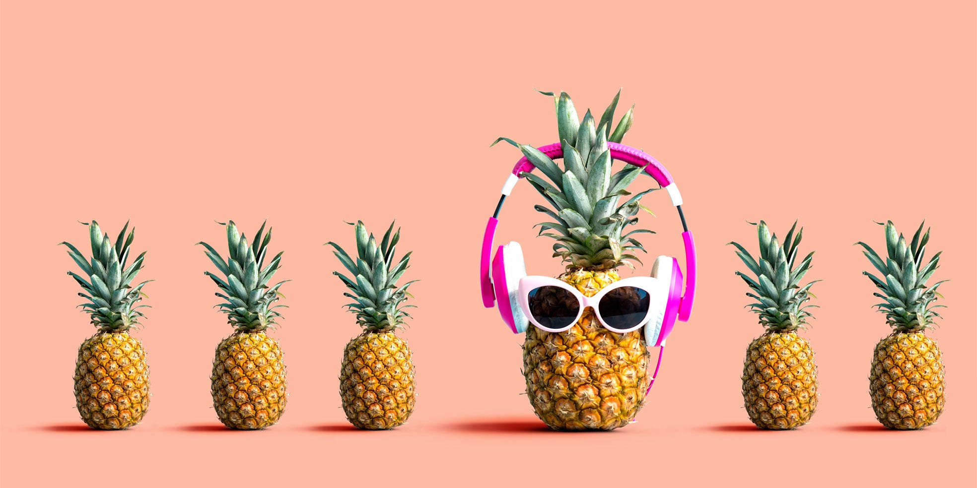 Rad pineapple with shades and headphones representing that it's okay to be different from other writers.