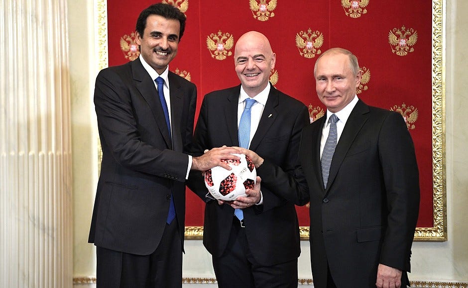 A picture of FIFA President Gianni Infantino flanked by the Emir of Qatar Tamim bin Hamad Al Thani and Russian President Vladimir Putin