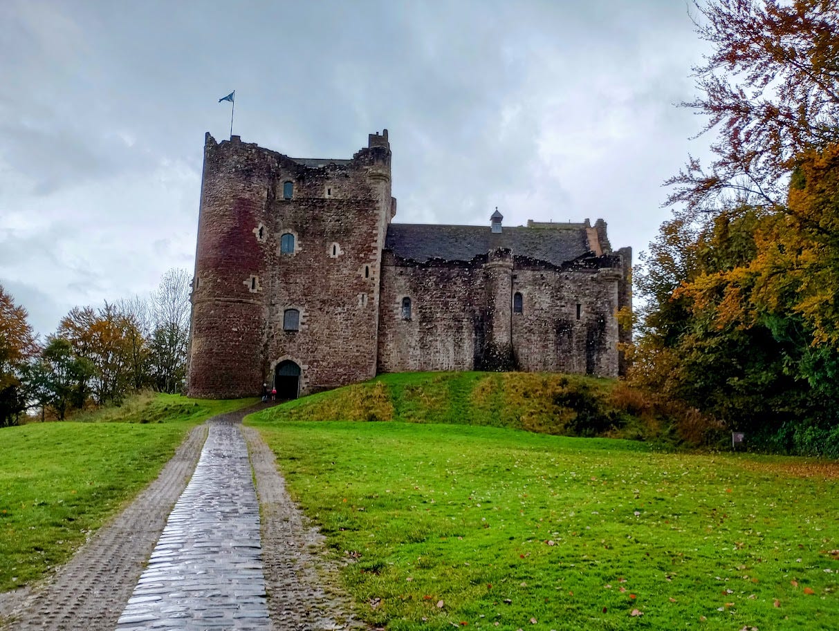 Five story castle tower with lower wing alongside