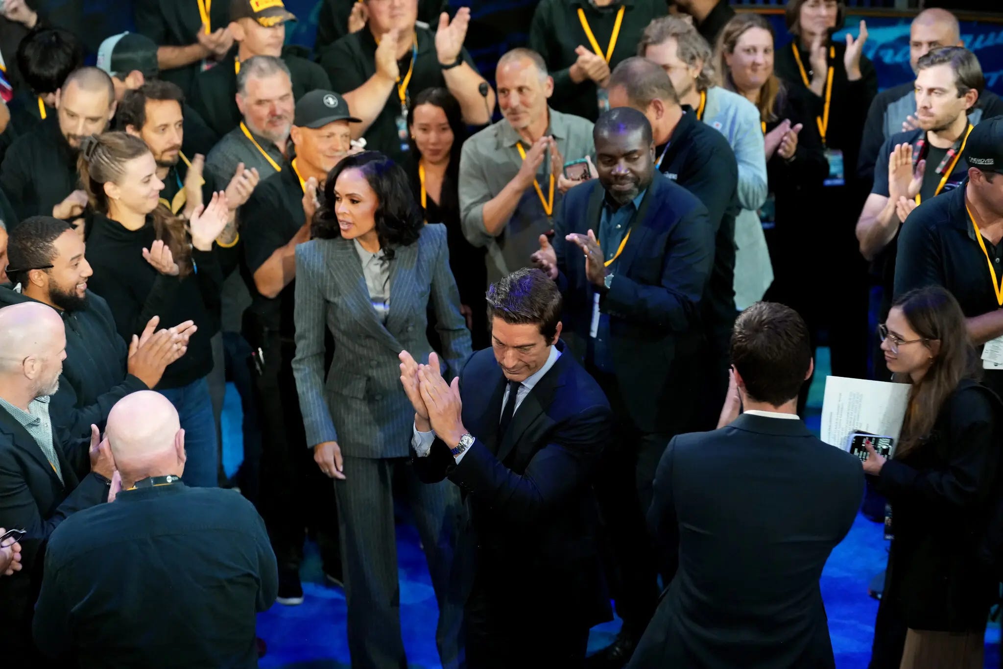 In the spin room, Trump surrogates are complaining about the moderators from ABC News, David Muir and Linsey Davis, below being applauded by ABC News colleagues. “It was a poor performance by the moderators,” said Vivek Ramaswamy, who ran for the Republican nomination himself in the primaries. He called the event “a three-on-one debate.” Photo: Doug Mills/The New York Times.