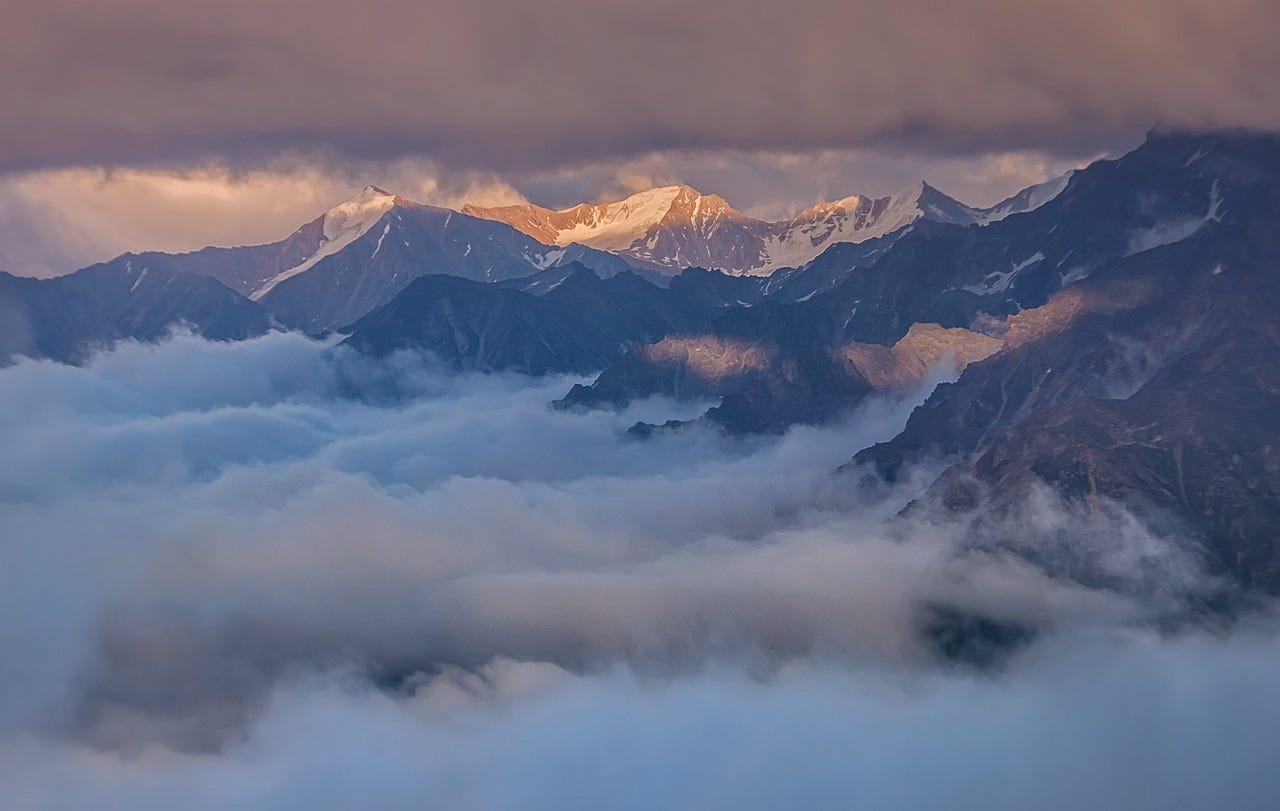 Mountain tops beyond the clouds Mountain tops beyond the clouds