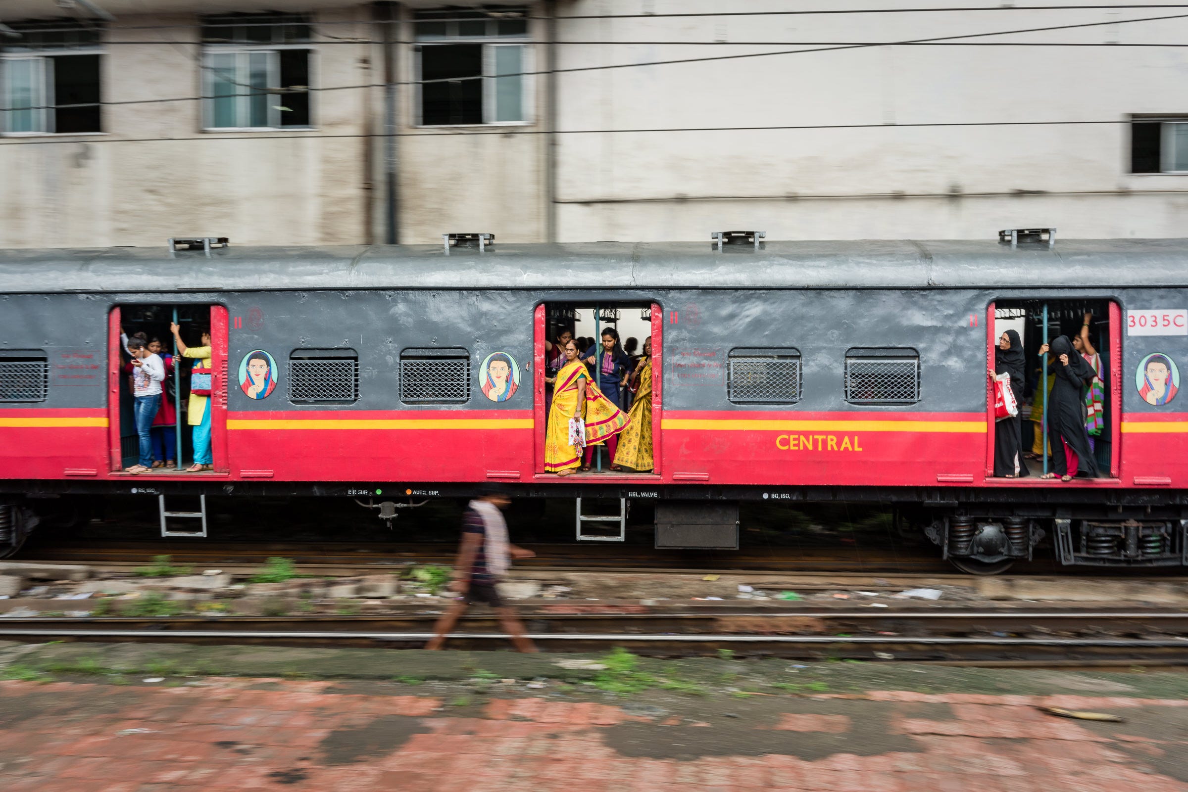 Women-only carriages are available on most trains, as indicated by the logo beside the open doors — 1/30th, f/16, ISO200, 35mm