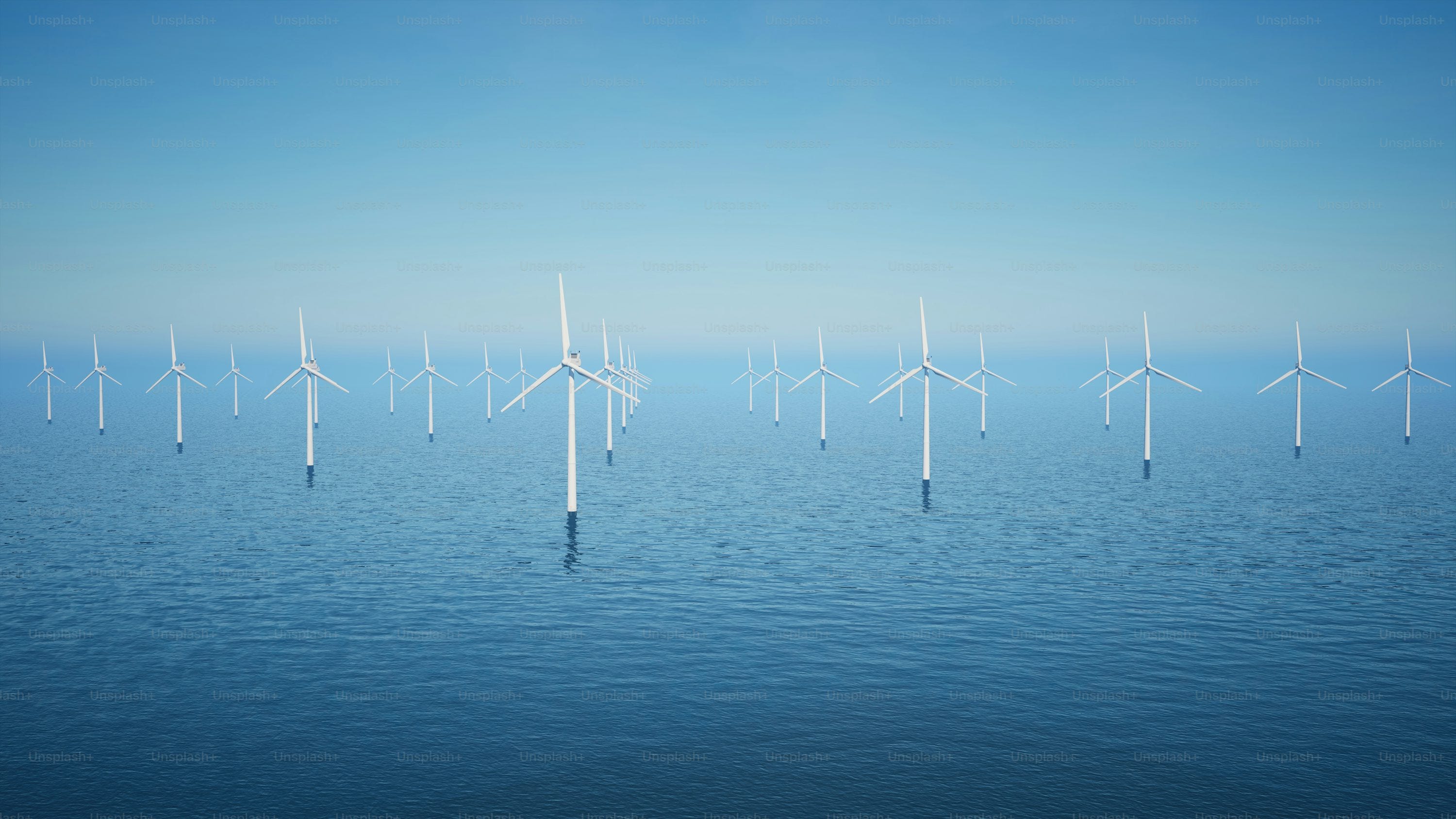 a group of windmills floating on top of a body of water