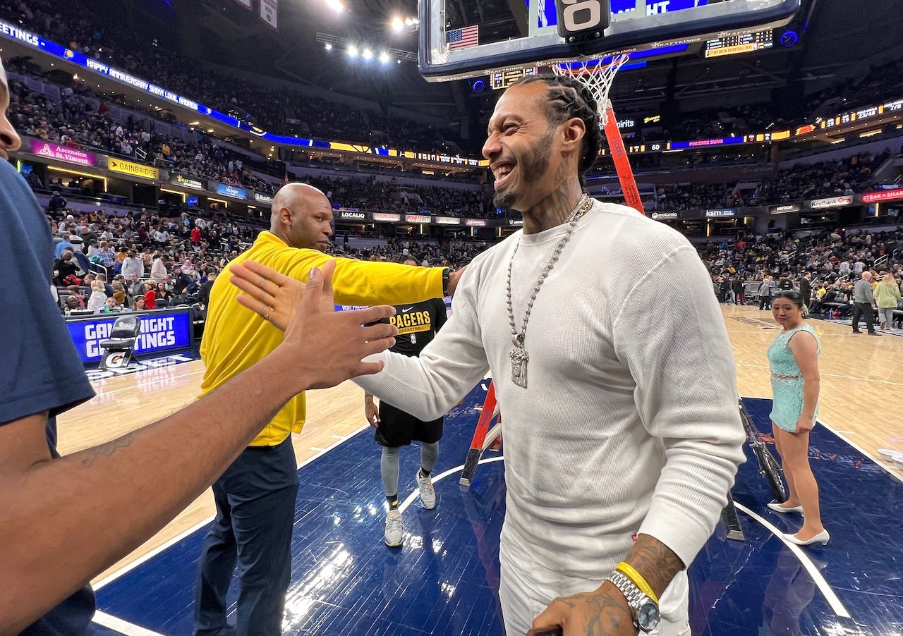 Several Pacers players and coaches spotted James Johnson and went to see him before heading back to the locker room at halftime.