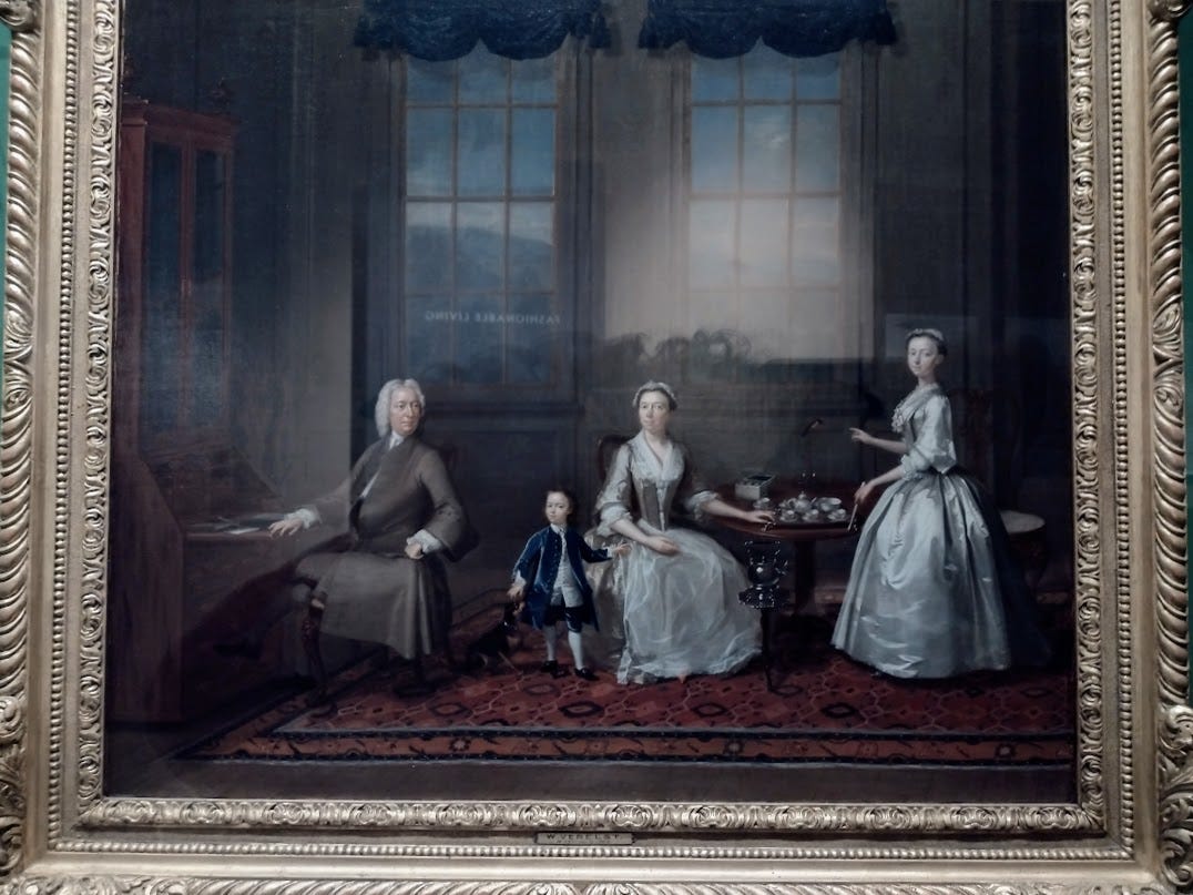 18th century family with teacups on table