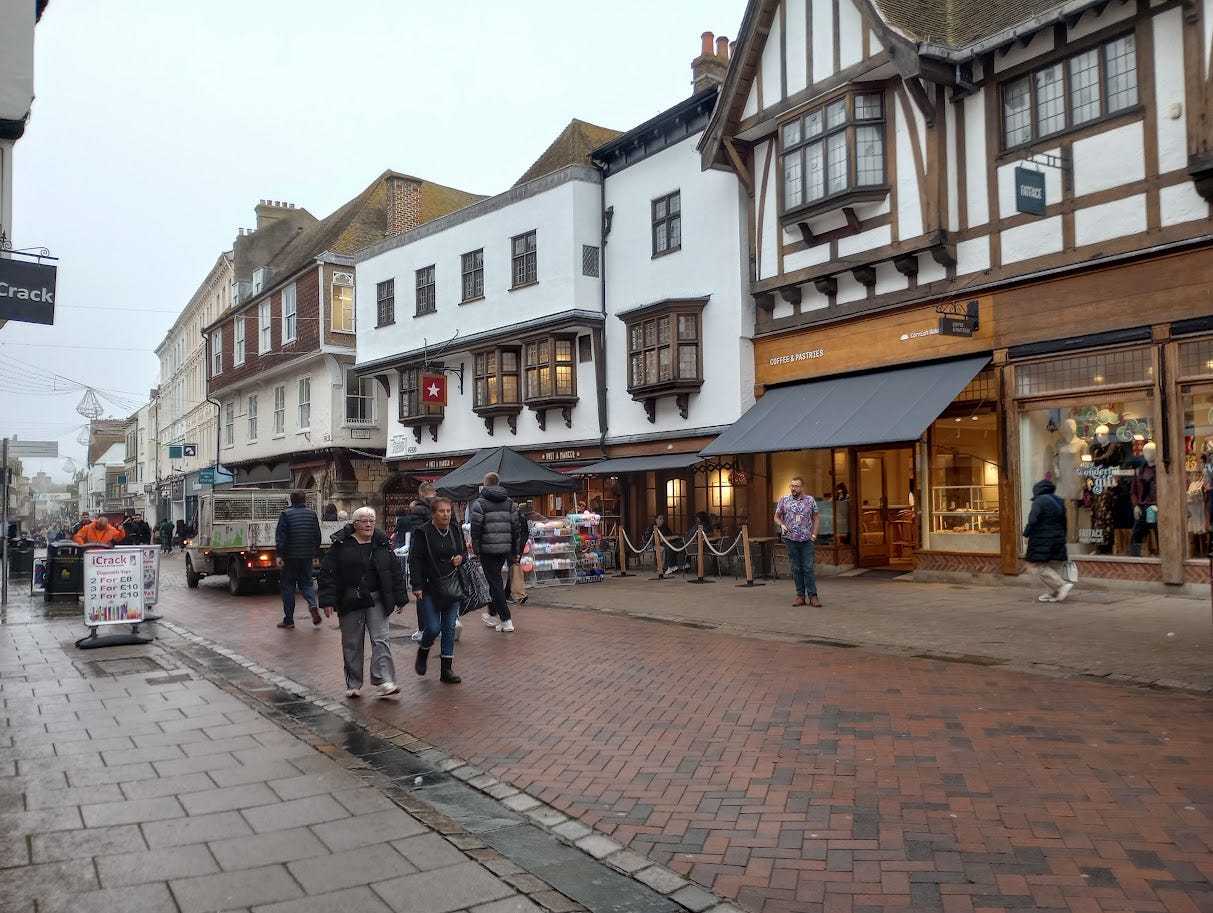 Street of varied buildings, many obviously very old with oak beams