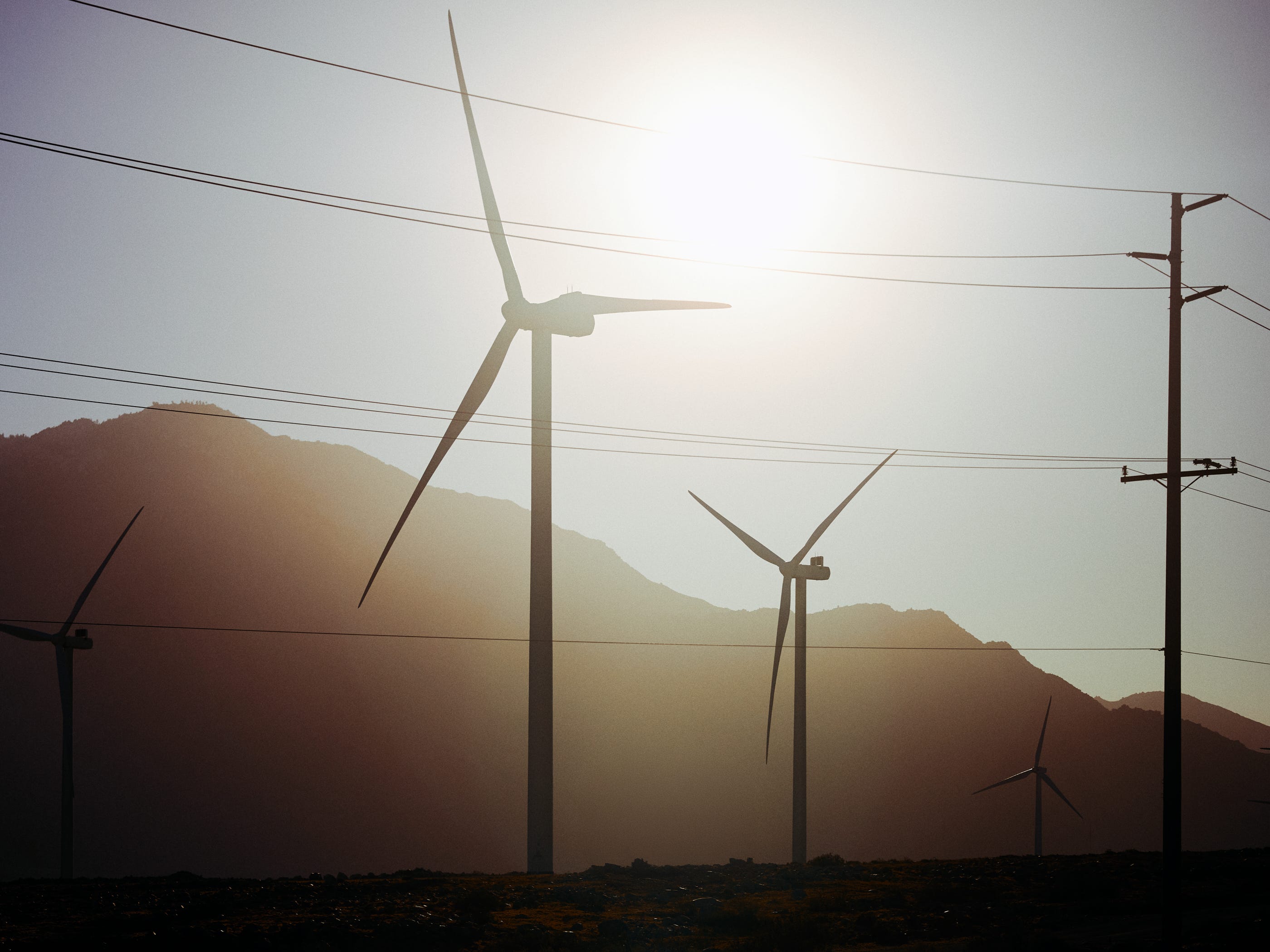 Silhouettes of windmills in the desert by Highway 10 on our back to Los Angeles by photographer Afonso Salcedo