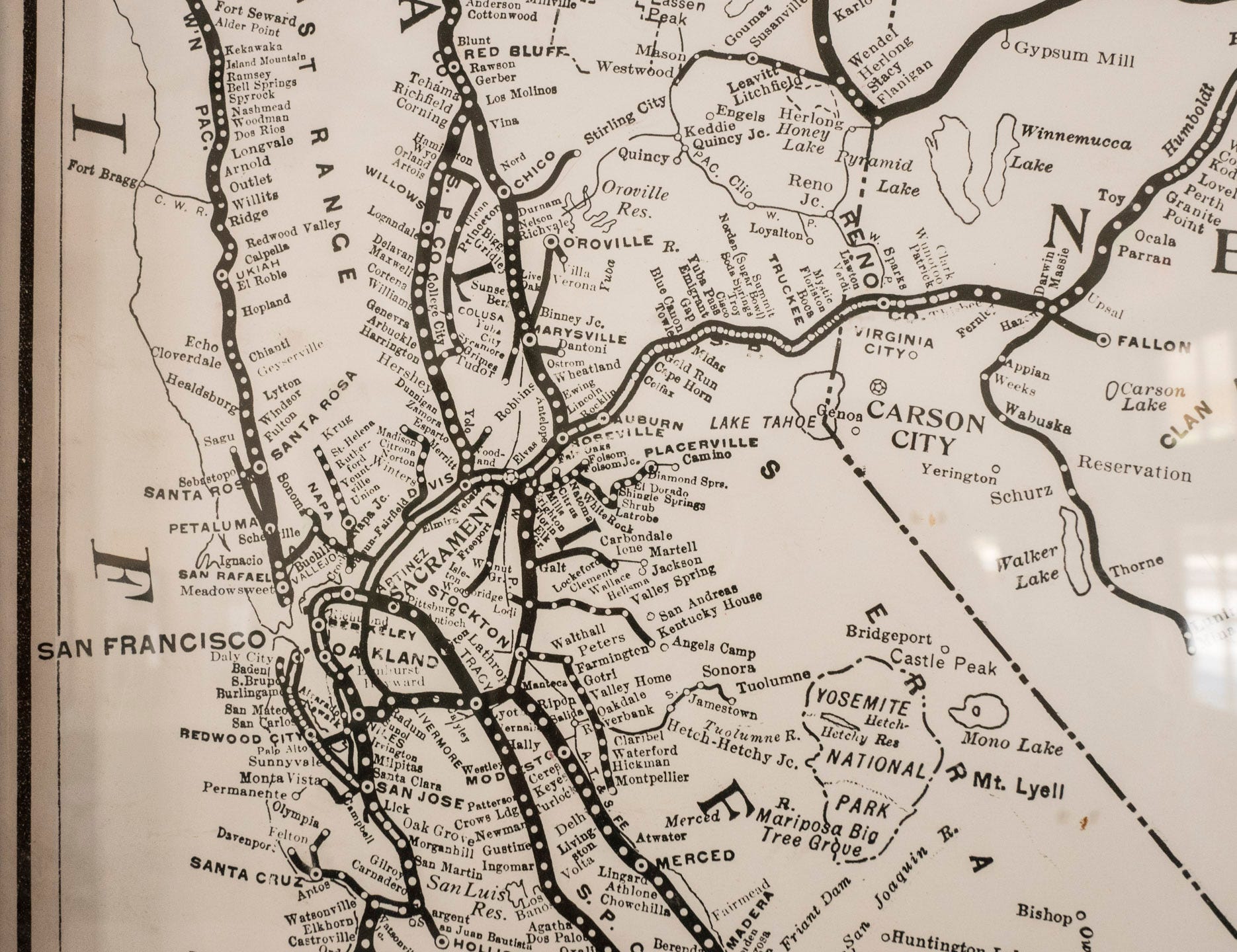Old railroad map with thick lines depicting railroad tracks and dots representing each railroad station. It is a simple, hand-drawn map of Northern California, including San Francisco, San Jose, and Santa Cruz (among others) to the south, stations as for north as Fort Seward, and to the east the western half of Nevada, including Reno, Carson City, Fallon, and others. The primary geographic references on the map are lakes - Taho, Mono, Walker, and others. Yosemite National Park is outlined as well.