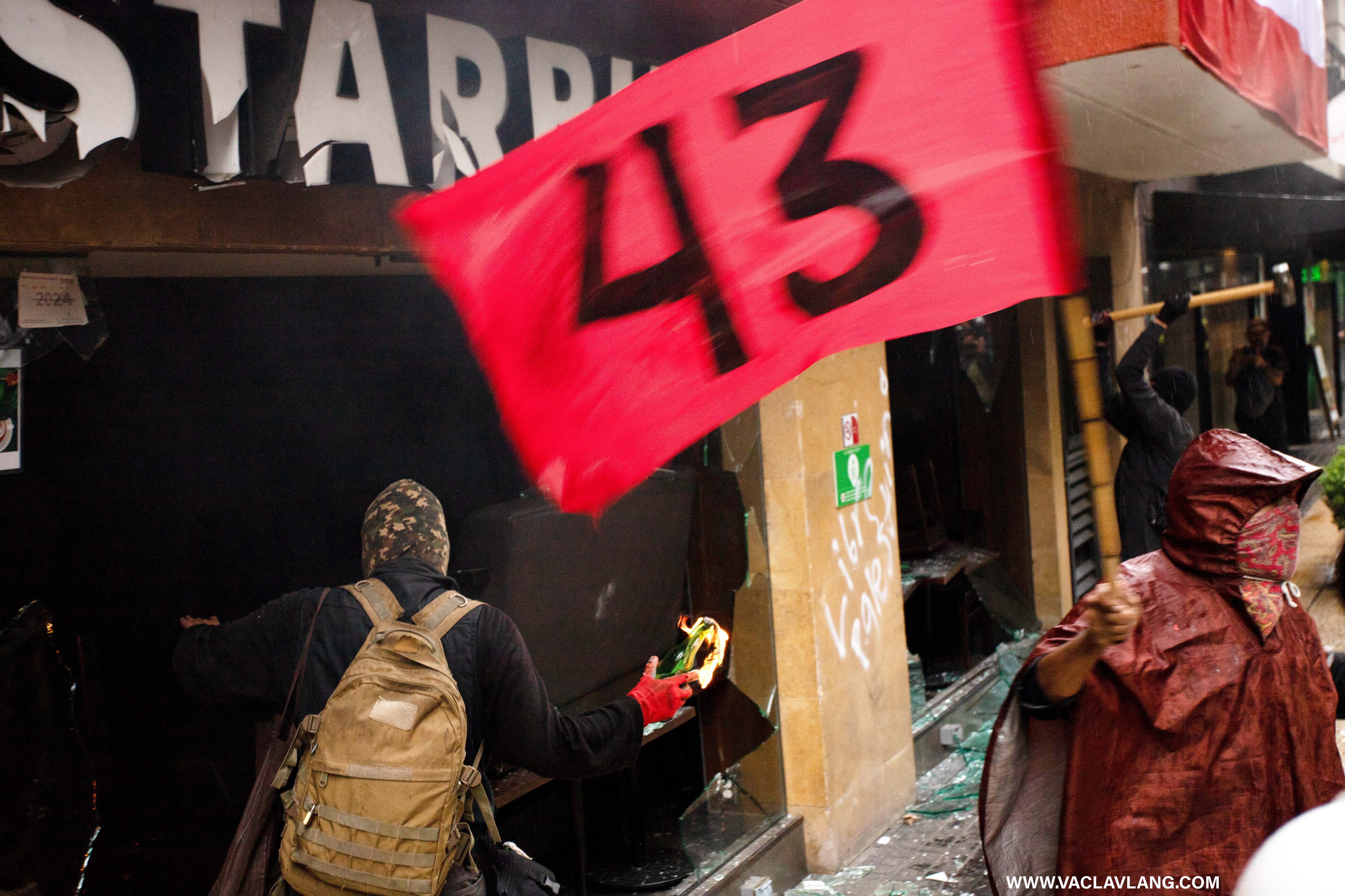 protesters in mexico city make riots in commemoration of the 10th anniversary of ayotzinapa