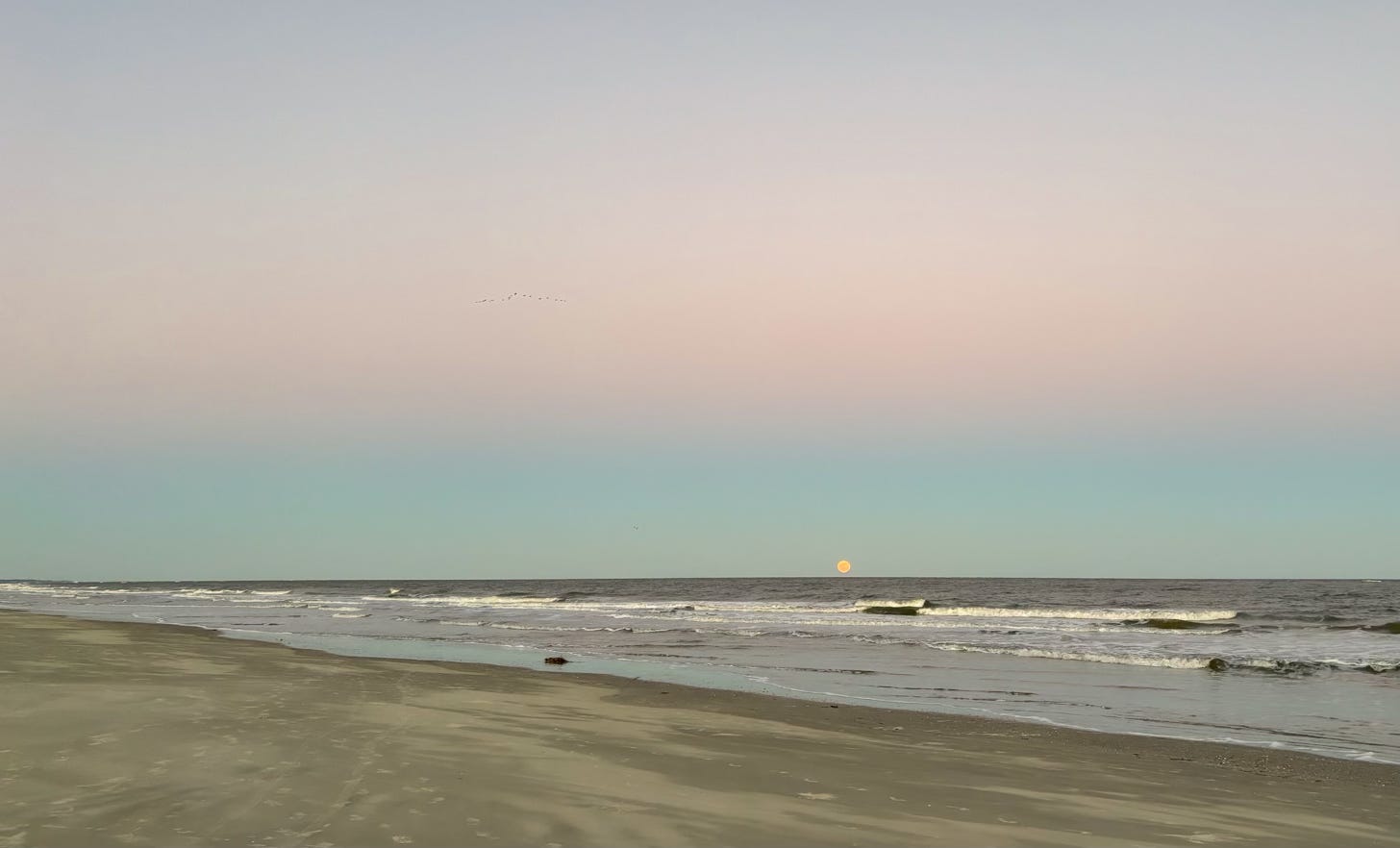 moonrise at dusk over ocean