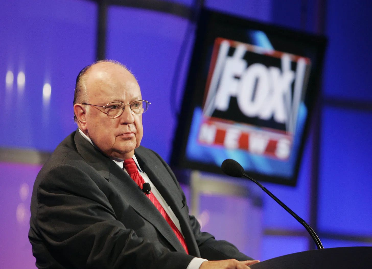 Photo of Roger Ailes with Fox News logo