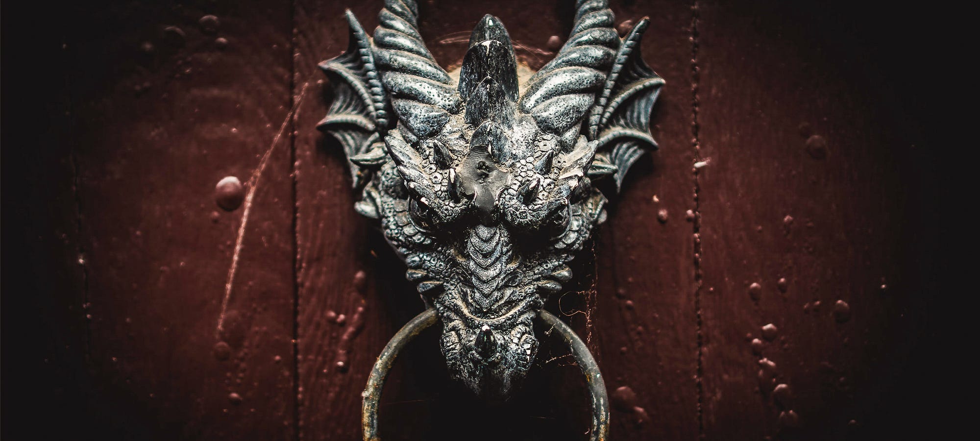 Dragon doorknob. (Photo by Jonathan Kemper on Unsplash)
