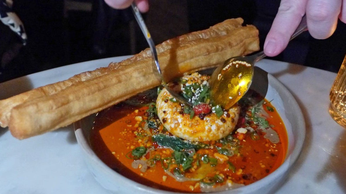 A white ball in red sauce.