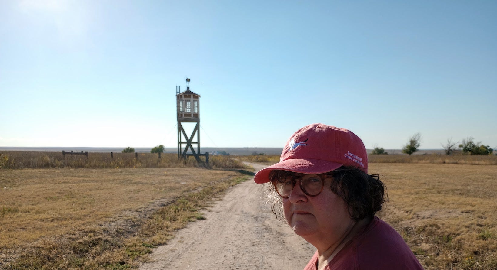 Annette with gun tower and flat empty landscape