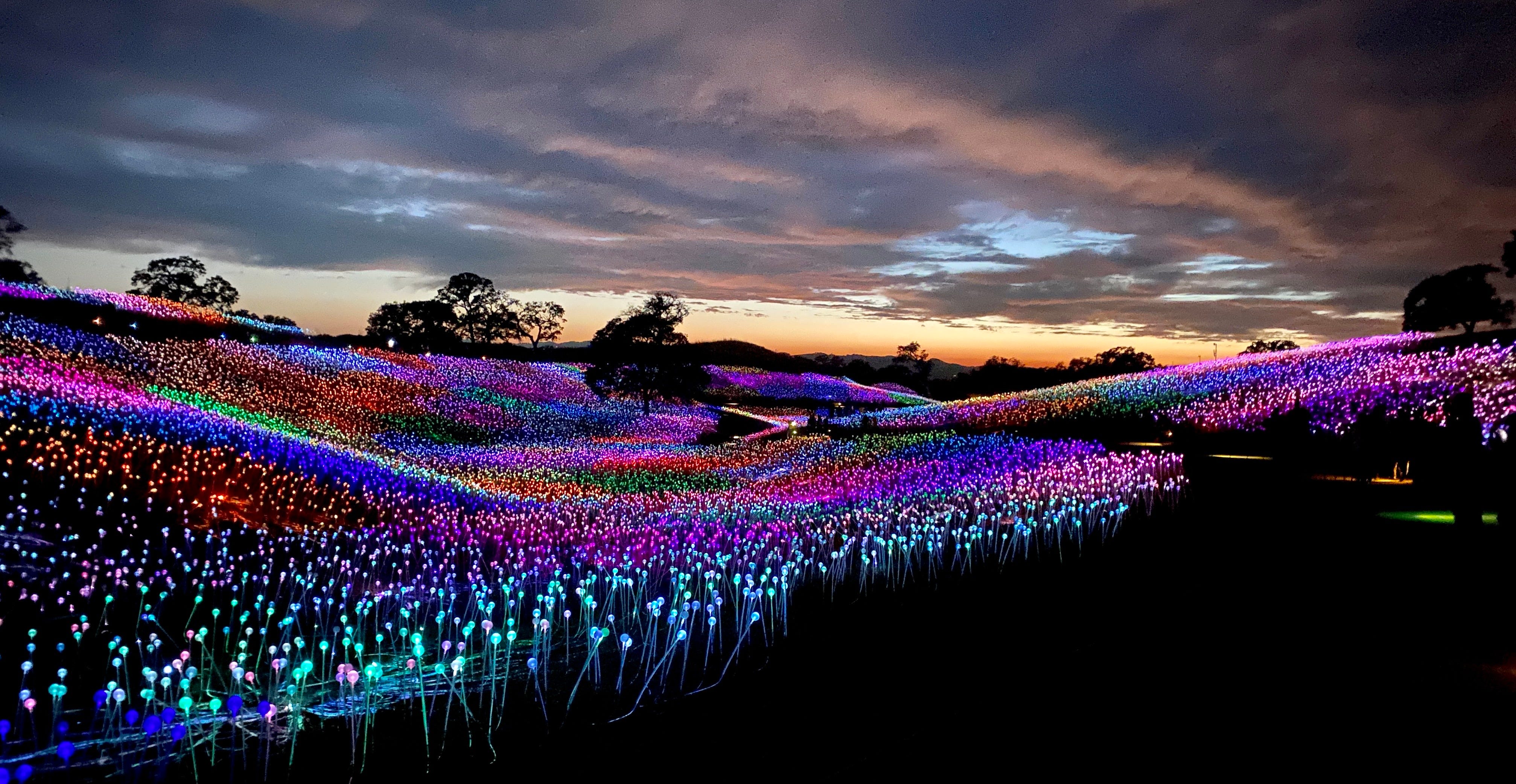 Rolling hills of multicolored LED lights at sunset at Sensorio, an art installation near Paso Robles, Calif.