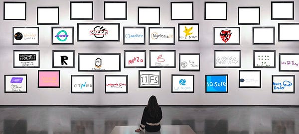 an art gallery with ironic bad versions of various company logos